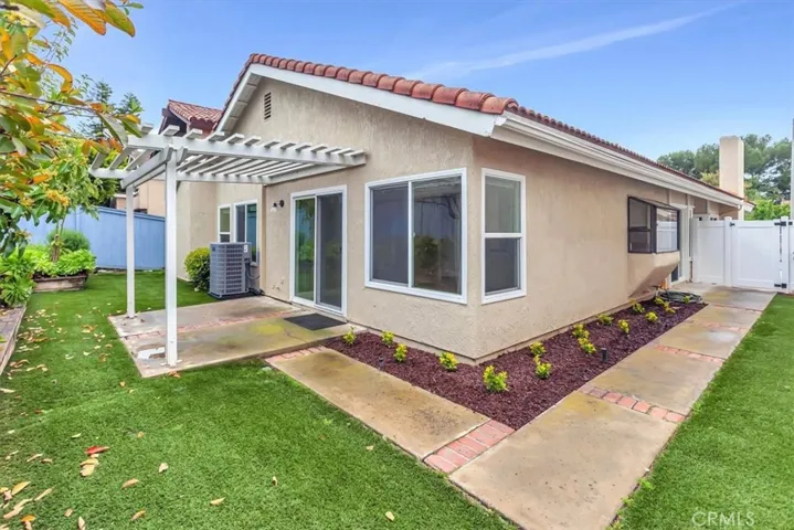 View back yard as well as side yard - landscaped - gardener offered with lease