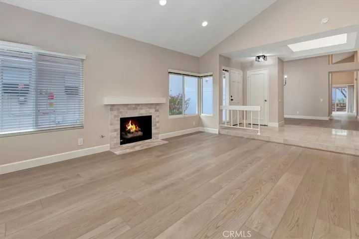 View from living room to entrance, newer entry light, dining room beyond