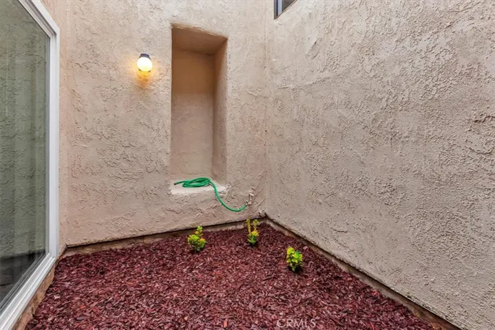 Atrium - slider on left if primary bedroom, opening in center lets in lots of light to primary bathroom tub - peaceful!