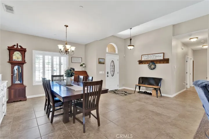 Open floor plan. Large dining room with tile floor.
