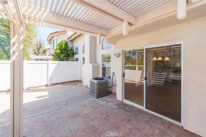 A large covered patio with a Trellis, designed for your family's comfort and to create memories