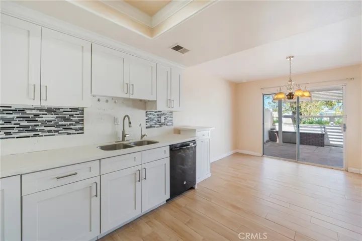 The kitchen portion that goes to the family covered trellis and patio