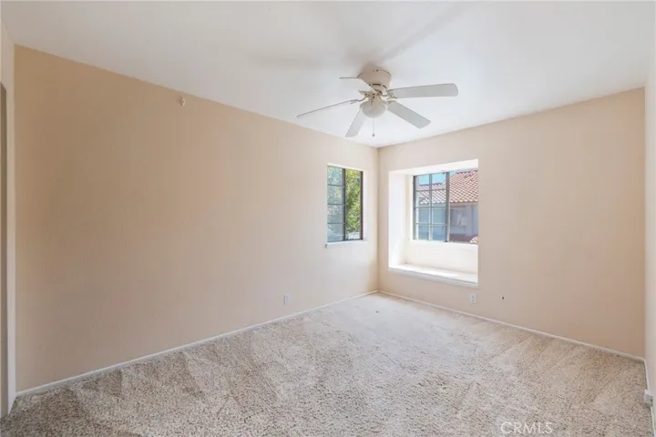 Bedroom 2 with its existing adjacent windows and a pre-installed seating zone facing the window