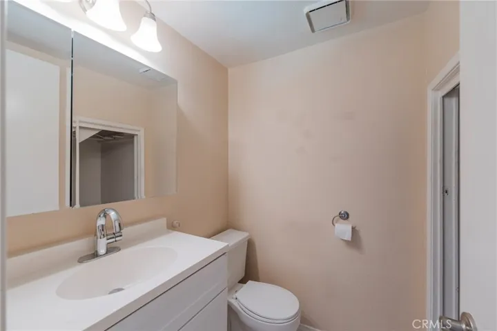 The spacious Powder Room is next to the family room
