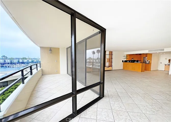 Balcony, Marina view and Living Room towards Kitchen