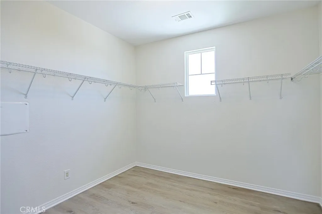 Primary Bed walk in closet