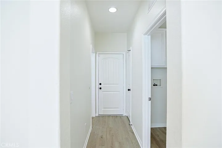 Hall to garage, laundry and bath