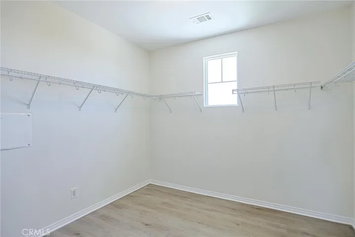 Primary Bed walk in closet