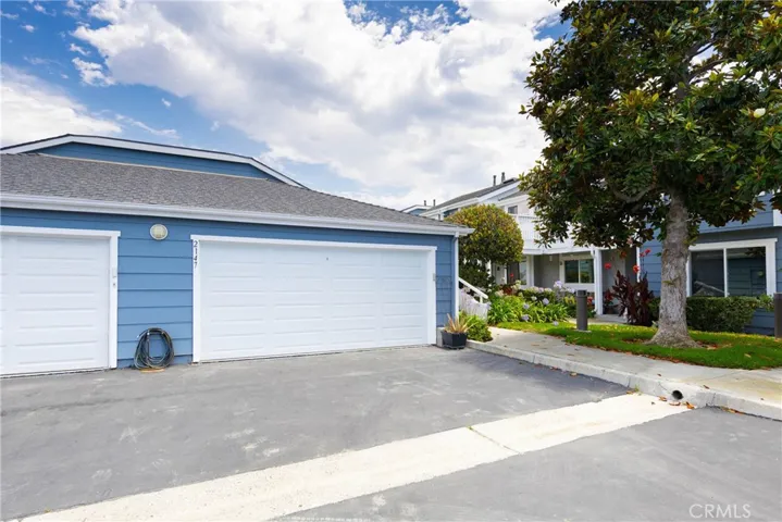 Double car garage at entrance to  upstairs condo