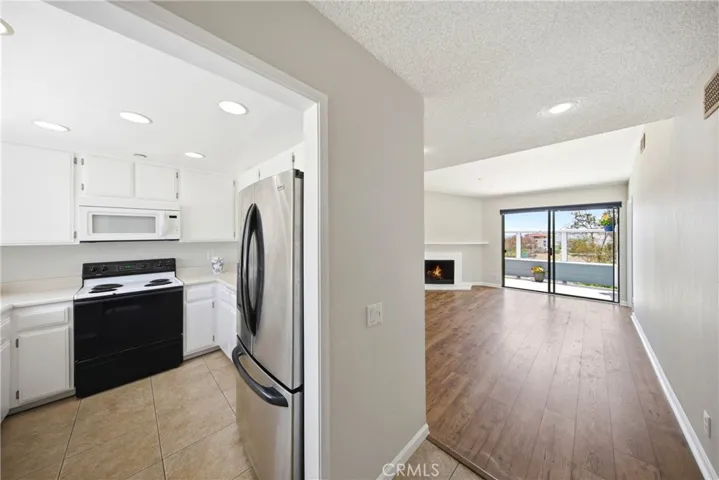 Entrance looking into kitchen and living room