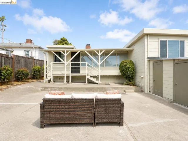 Expansive concrete patio with multiple storage units