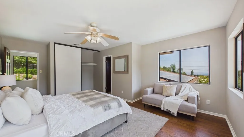 Spacious fourth bedroom suite situated above the garage, featuring a private 3/4 bathroom.
