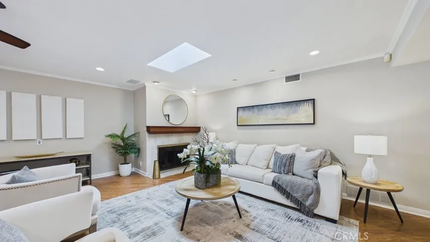 View of the living area with fireplace and skylight
