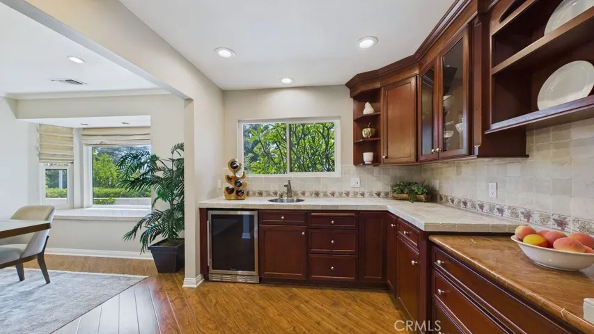 View of the butlers pantry with dining room on the Left.