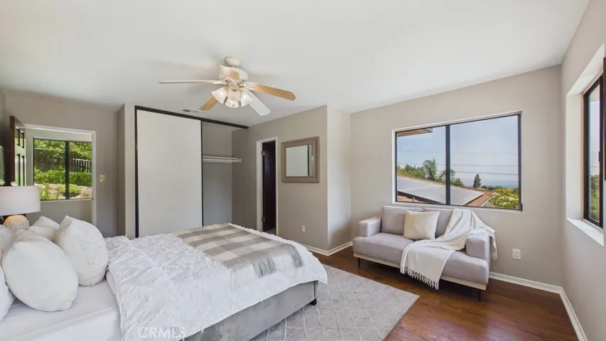 Spacious fourth bedroom suite situated above the garage, featuring a private 3/4 bathroom.