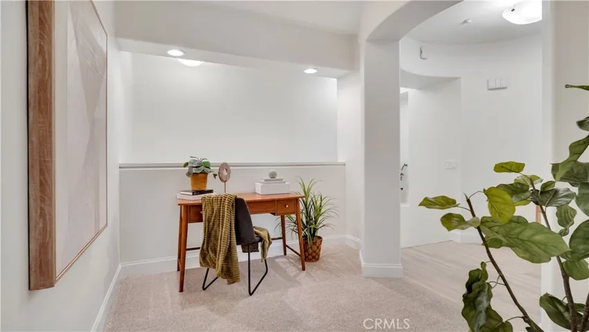 Just off the primary is a cozy loft, perfect for an office or reading area.