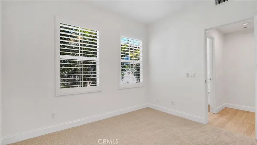 Third bedroom--Swiss Coffee on the walls and two tone designer carpet. Not showing in the picture, a new ceiling fan. The room has a...