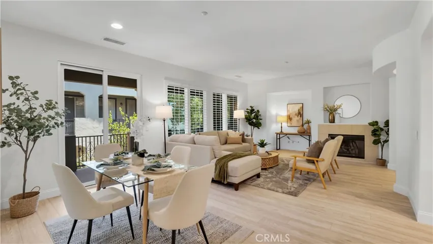 Notice the luxury flooring, plantation shutters and the sliding door that leads to an outdoor balcony.