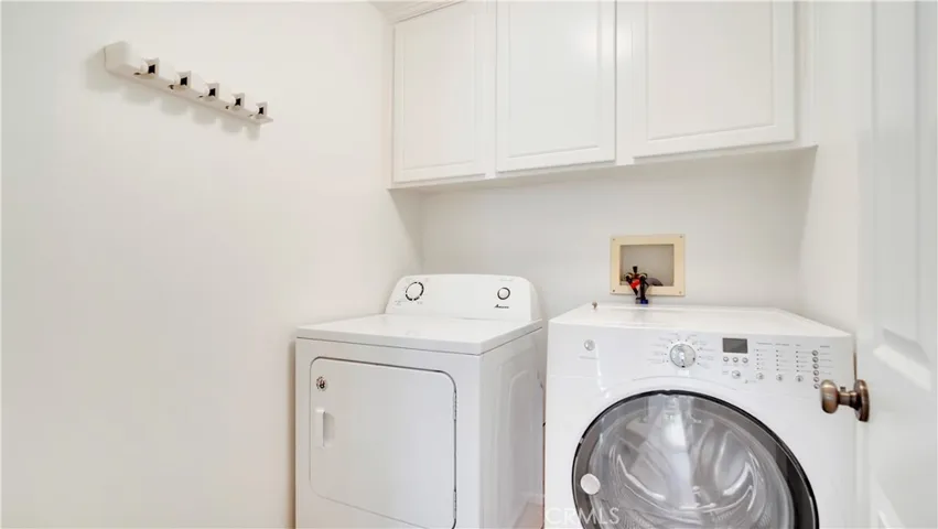 Separate laundry room. Washer and dryer are included.