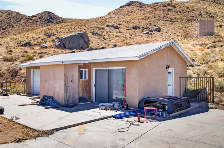 Detached two car garage with workshop and bathroom.