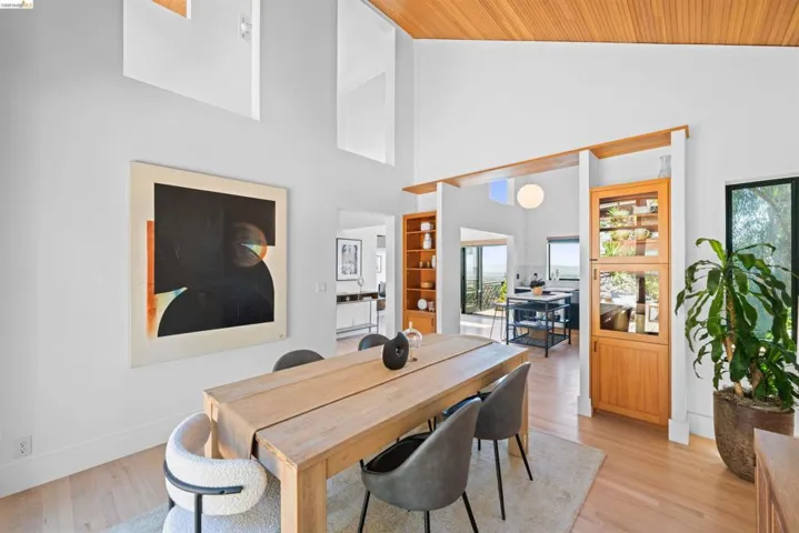 Dining area featuring a wood-finish dining table and light wood-finish flooring