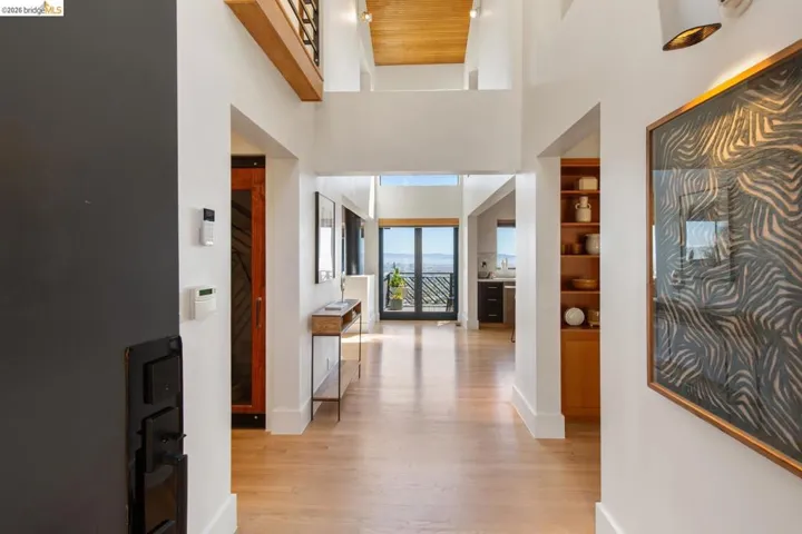 Spacious entryway with soaring angled ceilings that feature the Sea Cliff styling Richard Whitaker famously designed with his firm.