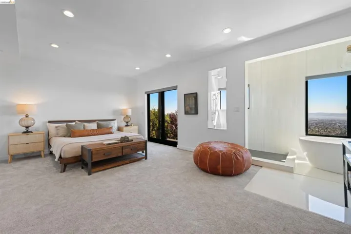 Spacious room featuring light-toned carpeting and recessed ceiling lighting