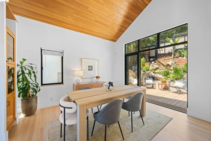 Vaulted wood-finish ceiling accentuates the open floor plan with wood-finish flooring