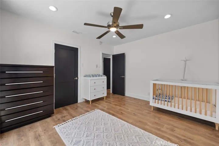 secondary bedroom with walk-in closet