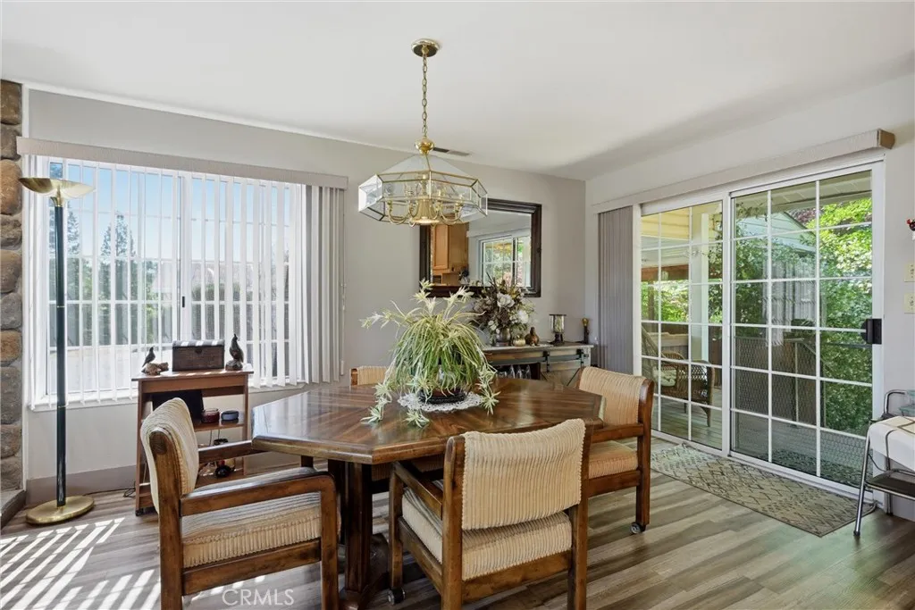 Dining area with slider leading to back porch and pool