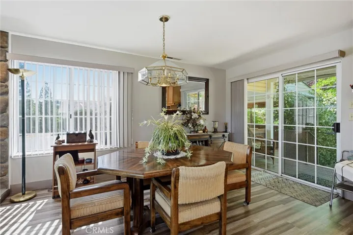 Dining area with slider leading to back porch and pool