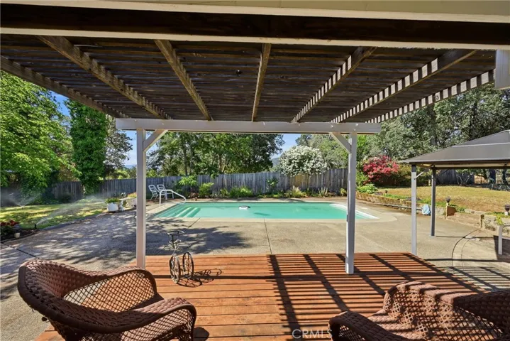 covered patio next to pool