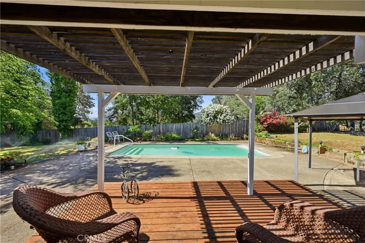 covered patio next to pool