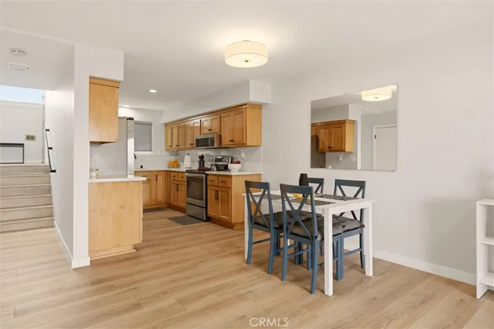 Custom kitchen with custom wood cabinets and quartz countertops.