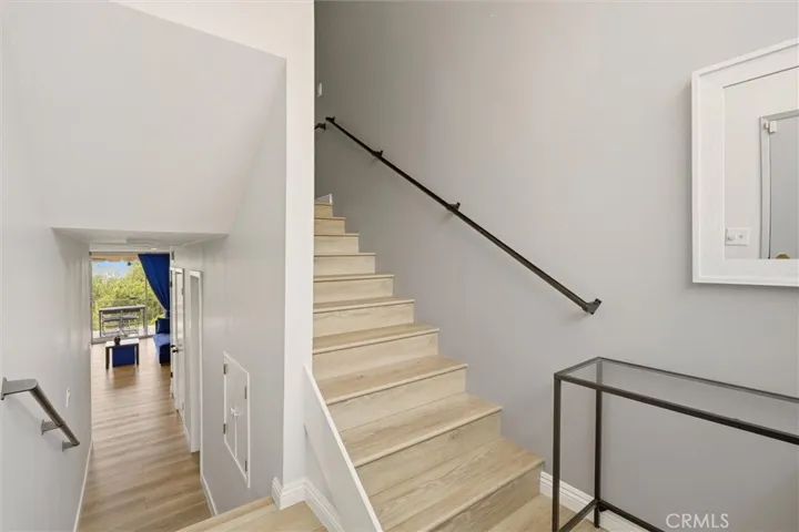 Interior staircase to upper level bedrooms and full bath.