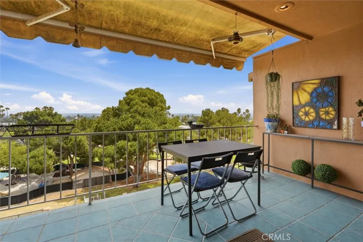 Covered balcony with the Hollywood sign centered on the horizon.