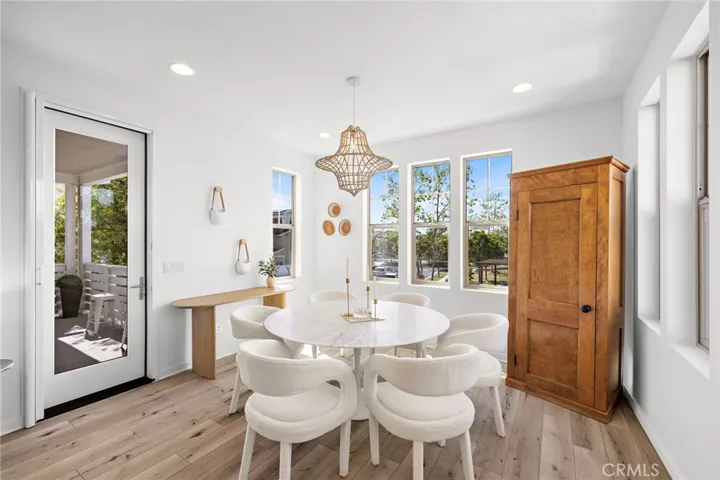 Dining area framed by natural light and warm design elements.