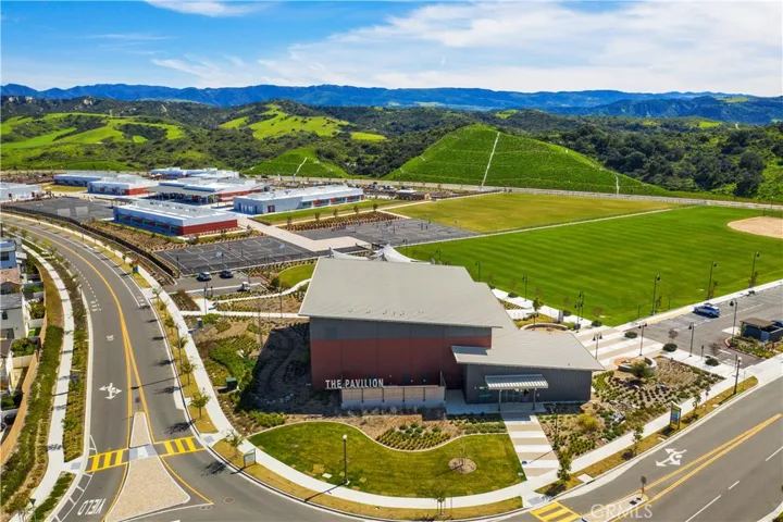 Community aerial capturing parks, open space, and proximity to a nearby K–8 school.