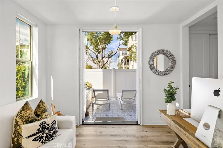 Versatile workspace with direct access to a private outdoor patio.