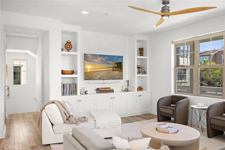 Built in entertainment center inviting gathering with polished finishes.