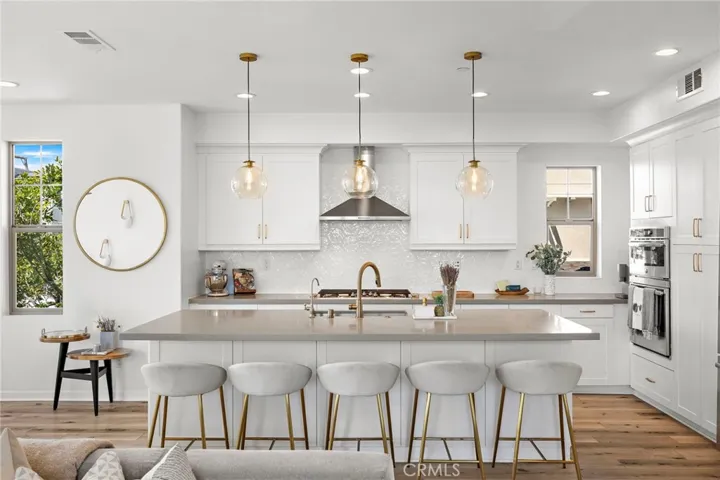 Expansive island anchoring a bright, thoughtfully designed kitchen.