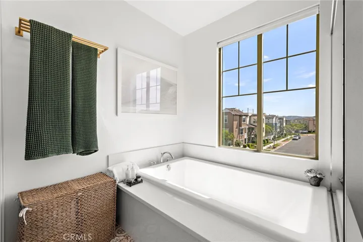 Primary bath soaking tub complemented by natural light and spa-like design.
