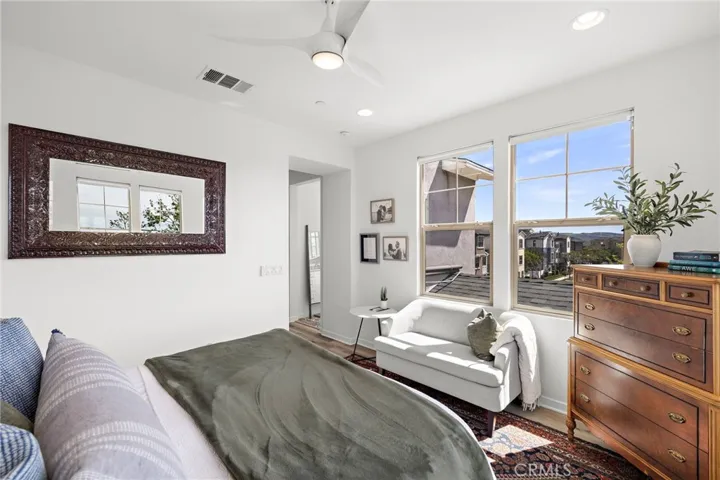 Comfortable primary bedroom retreat with soft natural light.