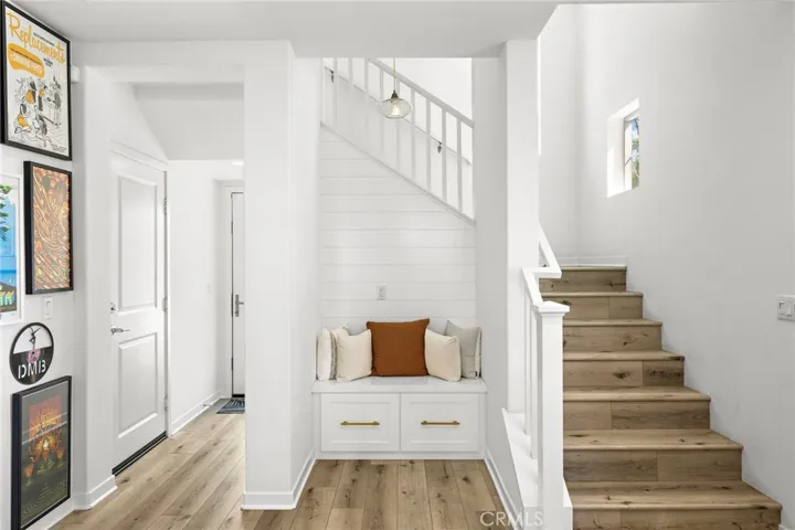 Thoughtfully designed entry nook with built-in seating for added function and style.