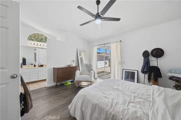 The spacious primary suite offers a peaceful retreat with direct patio access and a seamless connection to the ensuite bathroom.