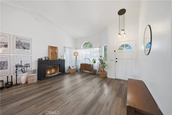 Large windows fill the space with natural light, creating a bright and airy atmosphere throughout.
