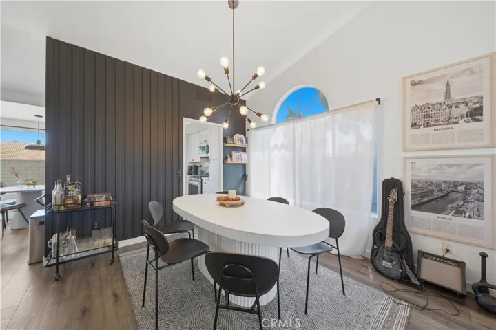 The dining area flows seamlessly into the kitchen, creating an open and functional space ideal for both everyday living and entertaining.