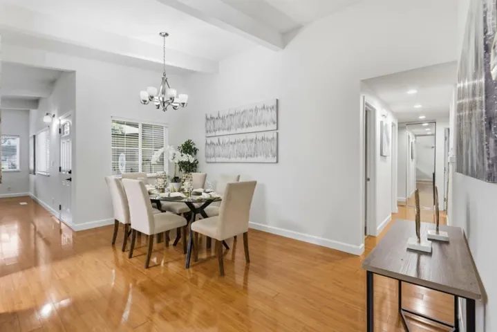 Spacious formal dining room with soaring ceilings and an open layout ideal for everyday living.