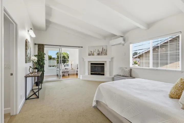 Expansive primary suite featuring fireplace, sitting area, and access to a private retreat.
