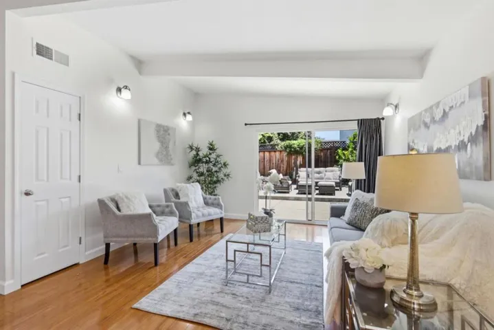 Spacious family room featuring abundant natural light and seamless indoor-outdoor living.